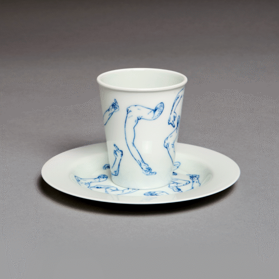 White porcelain cup and plate with blue motif
