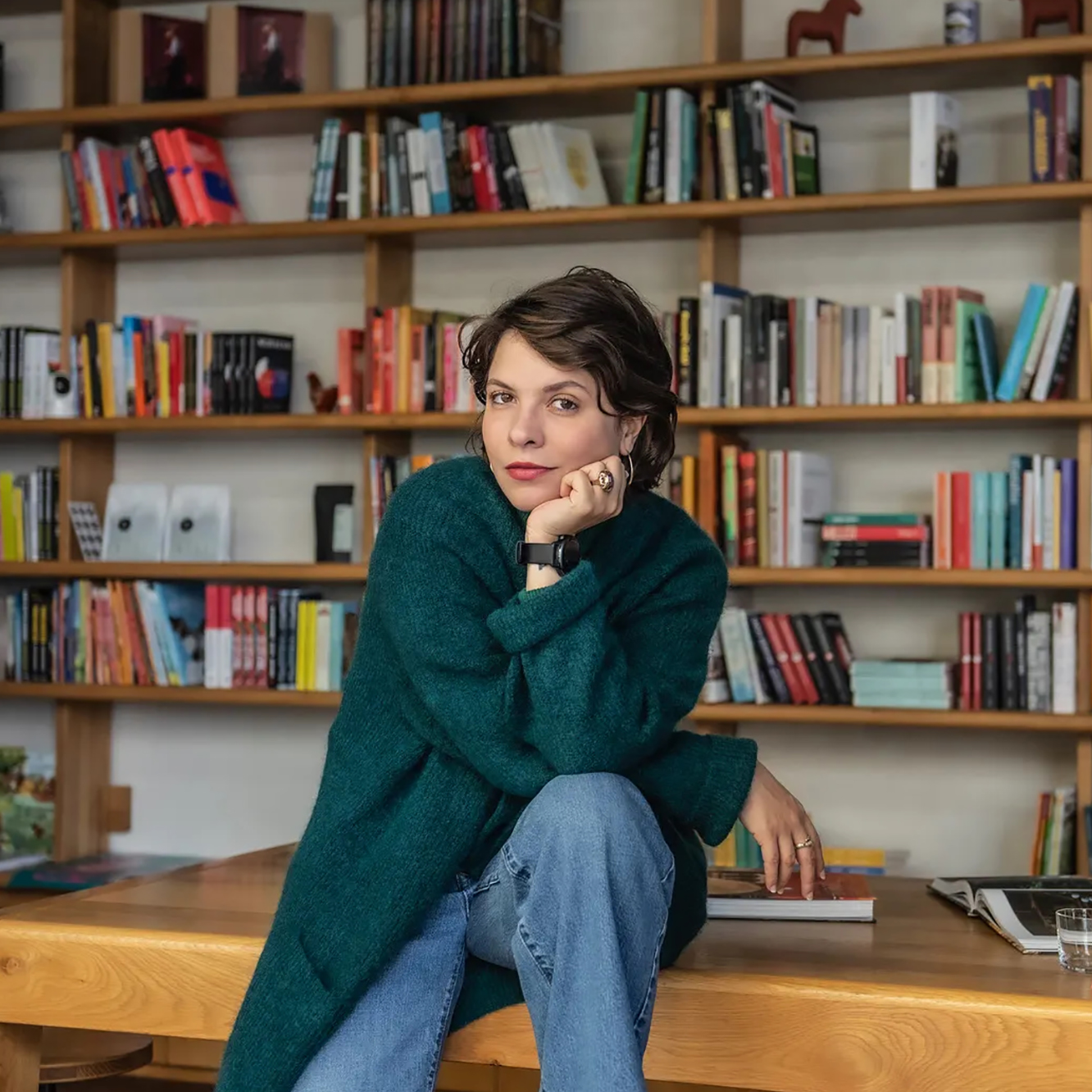 portrait in front of bookshelves